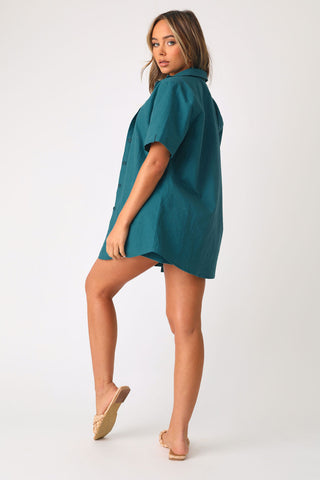 Full body back view of model wearing the Cool Breeze Linen shirt with matching Cool Breeze short.  