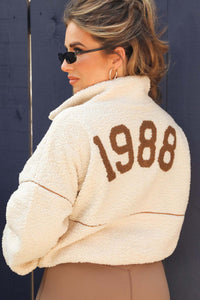 Jessie James Decker wearing the 1988 Cream Half Zip Pullover.