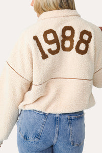 Model wearing the 1988 Cream Half Zip Pullover.
