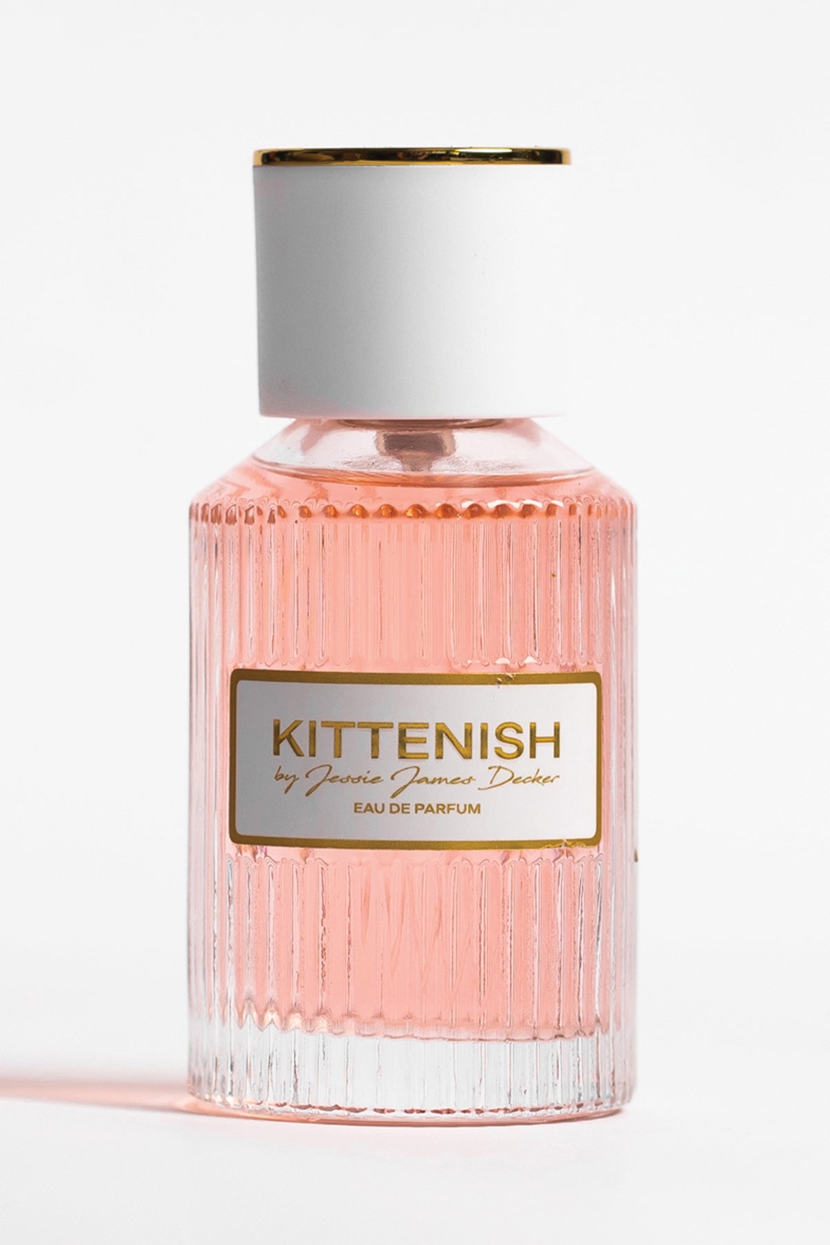 Kittenish perfume bottle on white background