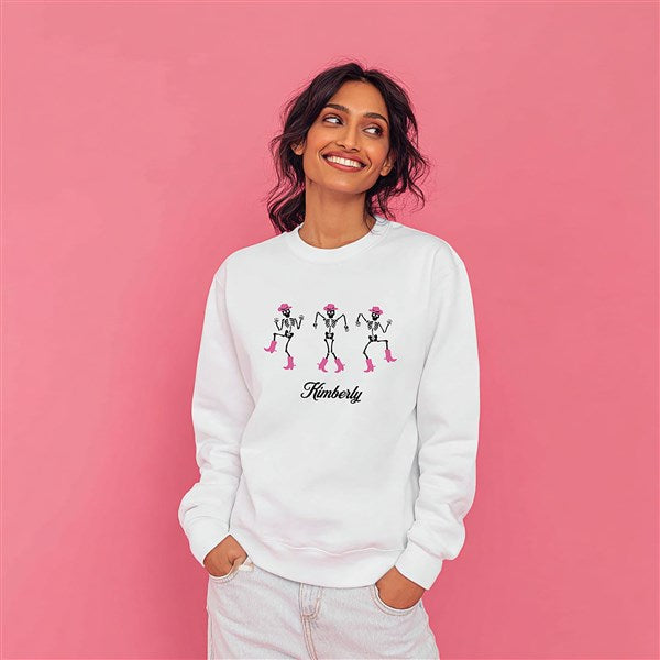 Model wearing a white dancing skeletons sweatshirt, from Things Remembered x Kittenish by Jessie James Decker 