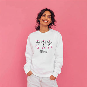 Model wearing a white dancing skeletons sweatshirt, from Things Remembered x Kittenish by Jessie James Decker 