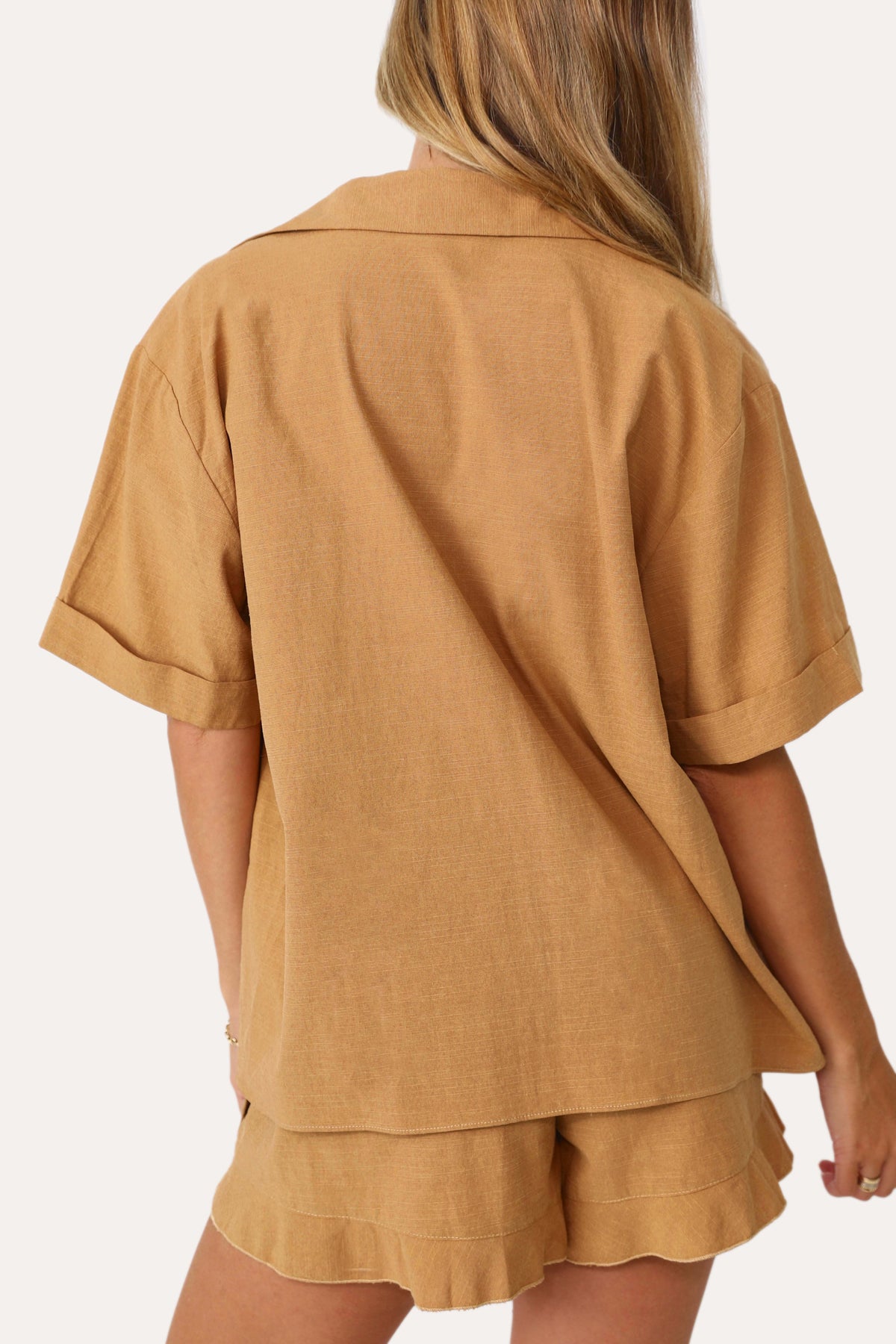 Model wearing the Home Town Tan Short Sleeve Button Up.