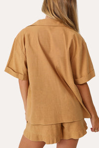 Model wearing the Home Town Tan Short Sleeve Button Up.