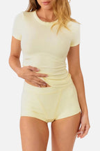 A model wearing pale yellow high-waisted ribbed boyshorts and matching tee