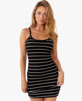 model wearing black and white striped mini dress standing in front of a white background 
