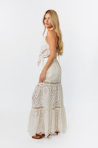 Woman wearing a white outfit on a white background