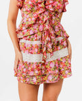 Woman wearing a floral skirt on a white background