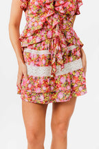 Woman wearing a floral skirt on a white background