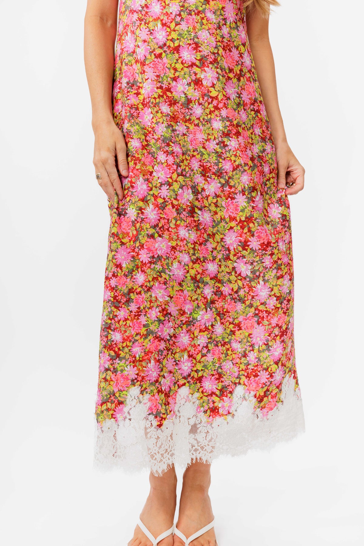 Woman wearing a floral dress on a white background