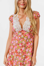 Woman wearing a floral dress on a white background
