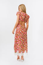Woman wearing a floral dress on a white background