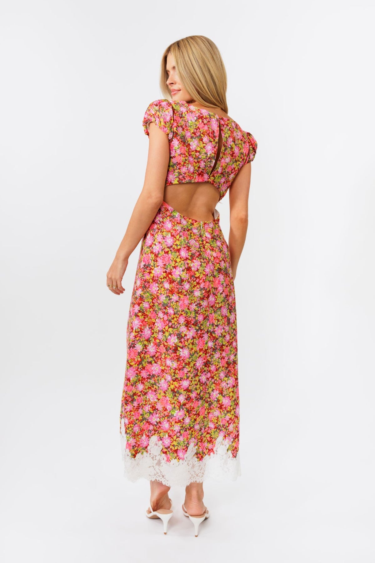 Woman wearing a floral dress on a white background