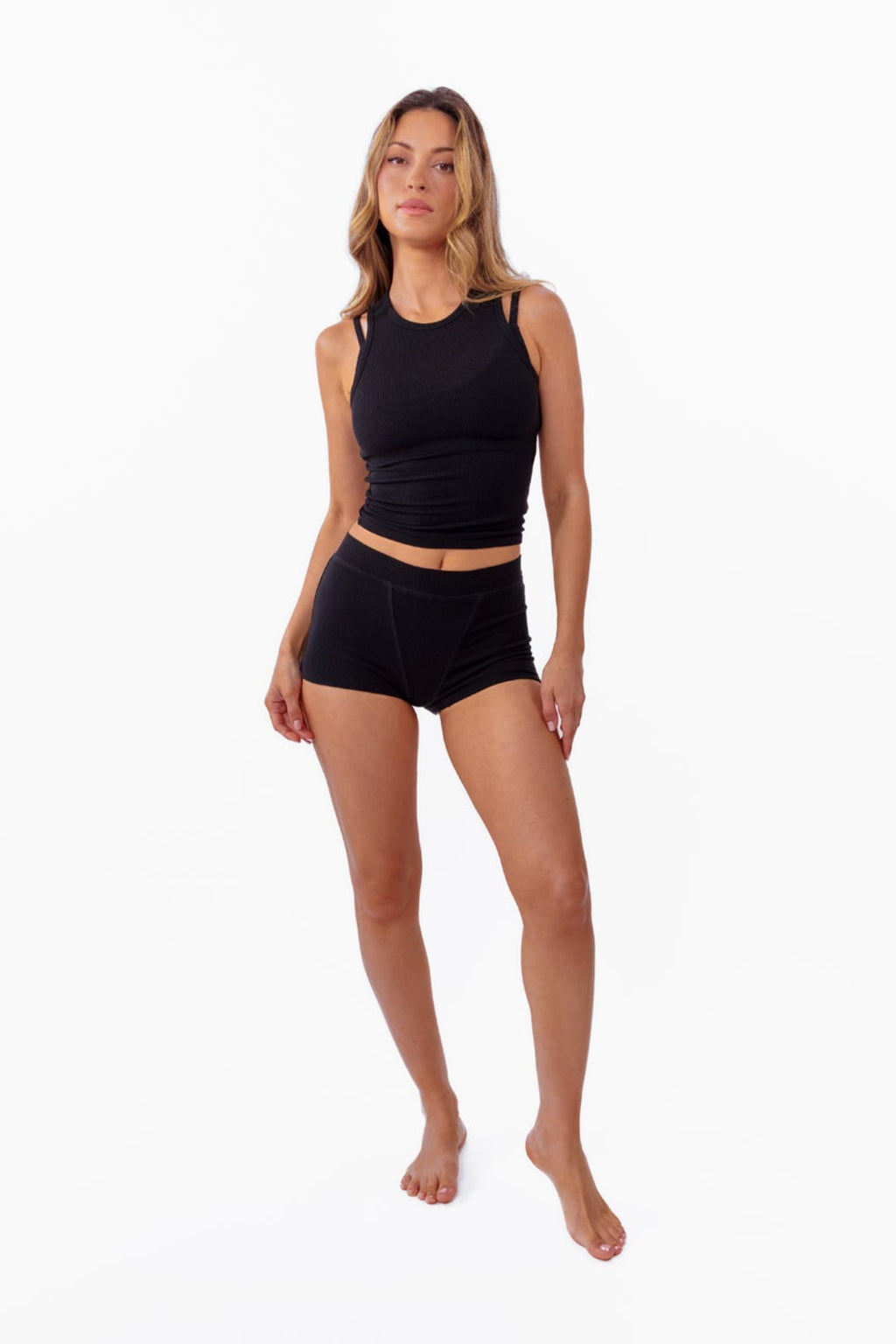 model wearing black ribbed tank with matching boyshorts