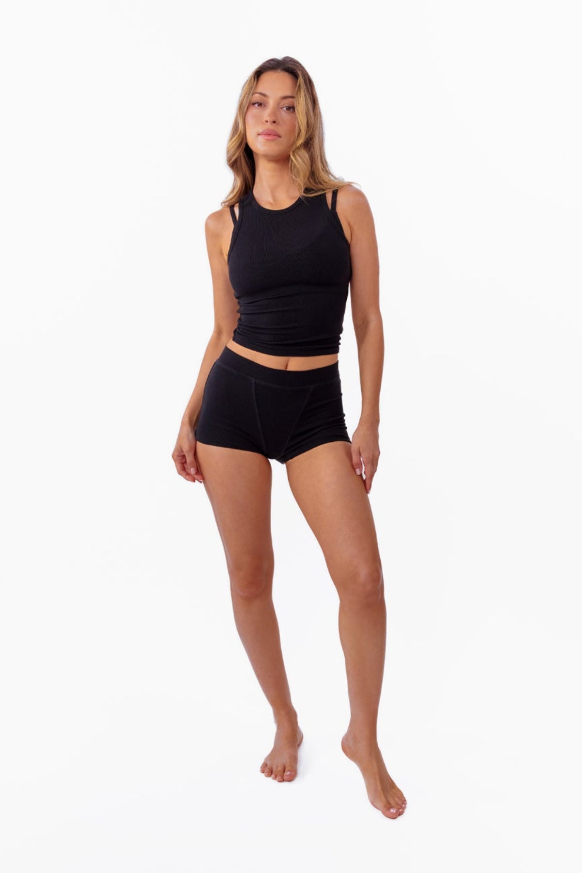 model wearing black ribbed tank with matching boyshorts
