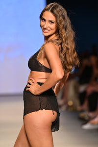 Model Olga Safari wearing the Isla Mesh coverup short on the runway at Miami Swim Week