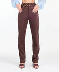 model wearing brown high waisted skinny straight leg pants with brown kitten heels.