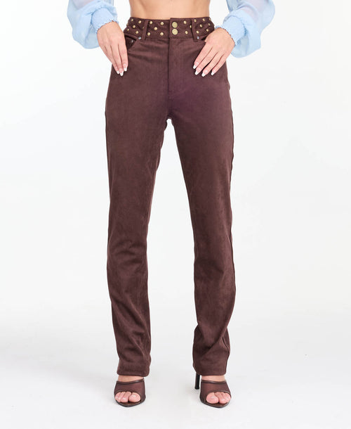 model wearing brown high waisted skinny straight leg pants with brown kitten heels.