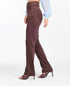 model wearing brown high waisted skinny straight leg pants with brown kitten heels.