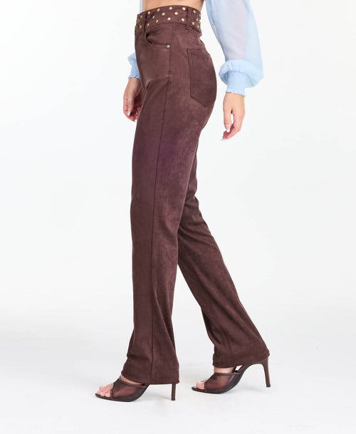 model wearing brown high waisted skinny straight leg pants with brown kitten heels.