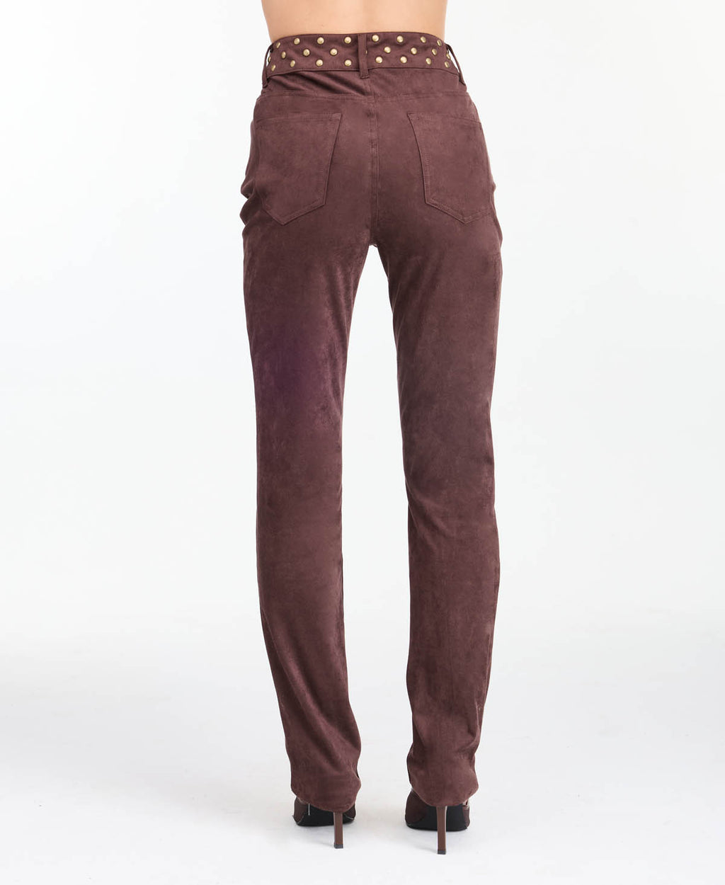 model wearing brown high waisted skinny straight leg pants with brown kitten heels.