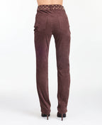 model wearing brown high waisted skinny straight leg pants with brown kitten heels.