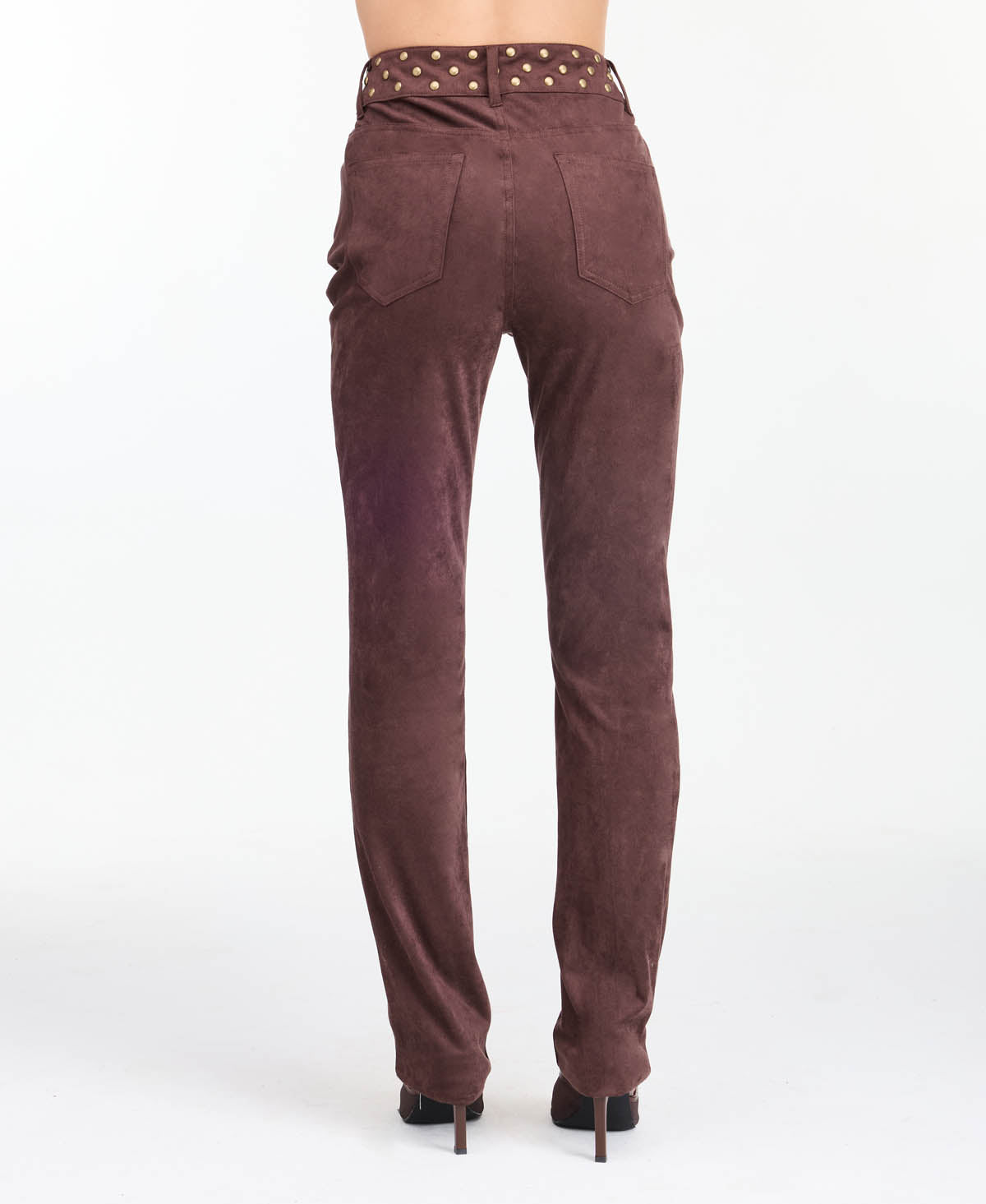 model wearing brown high waisted skinny straight leg pants with brown kitten heels.