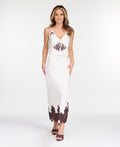 A woman modeling a white midi with dark brown lace detailing on the bodice of tank and hem, standing against a plain white studio background.