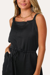 Model wearing the Jess Black Satin Jumpsuit.