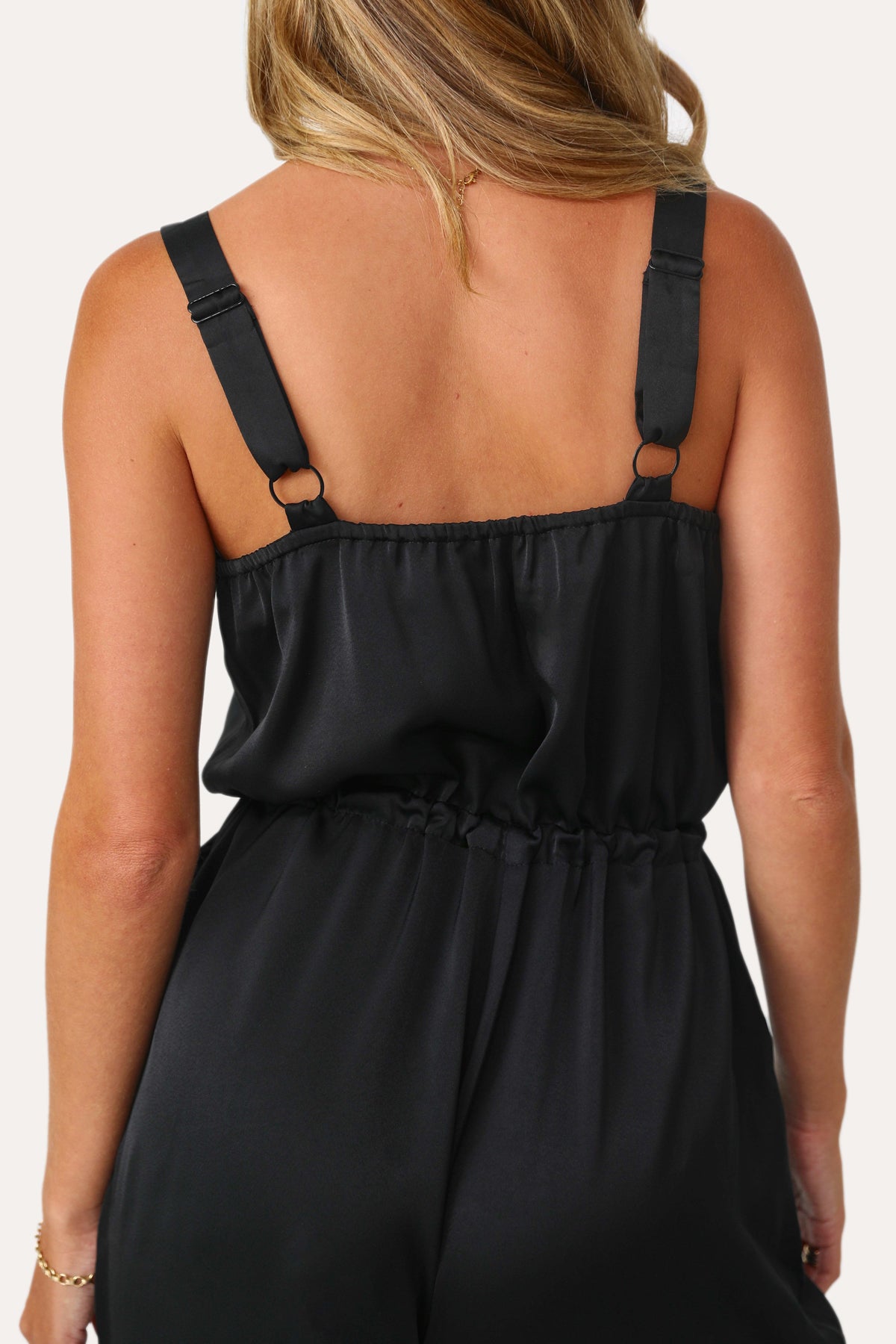 Model wearing the Jess Black Satin Jumpsuit.