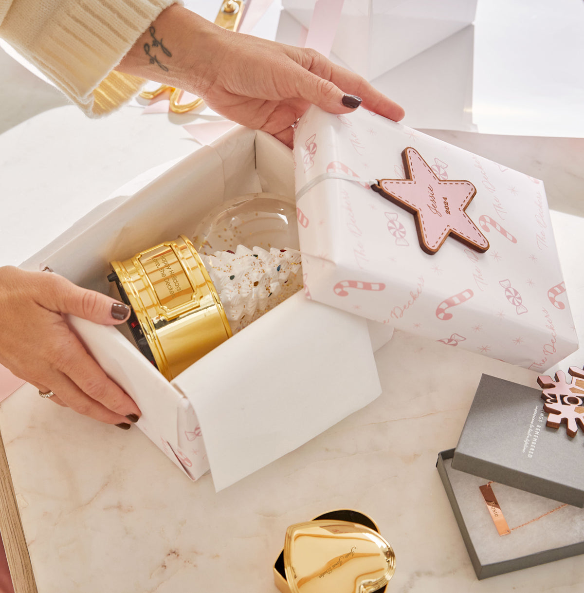 Jessie wrapping a snow globe gift