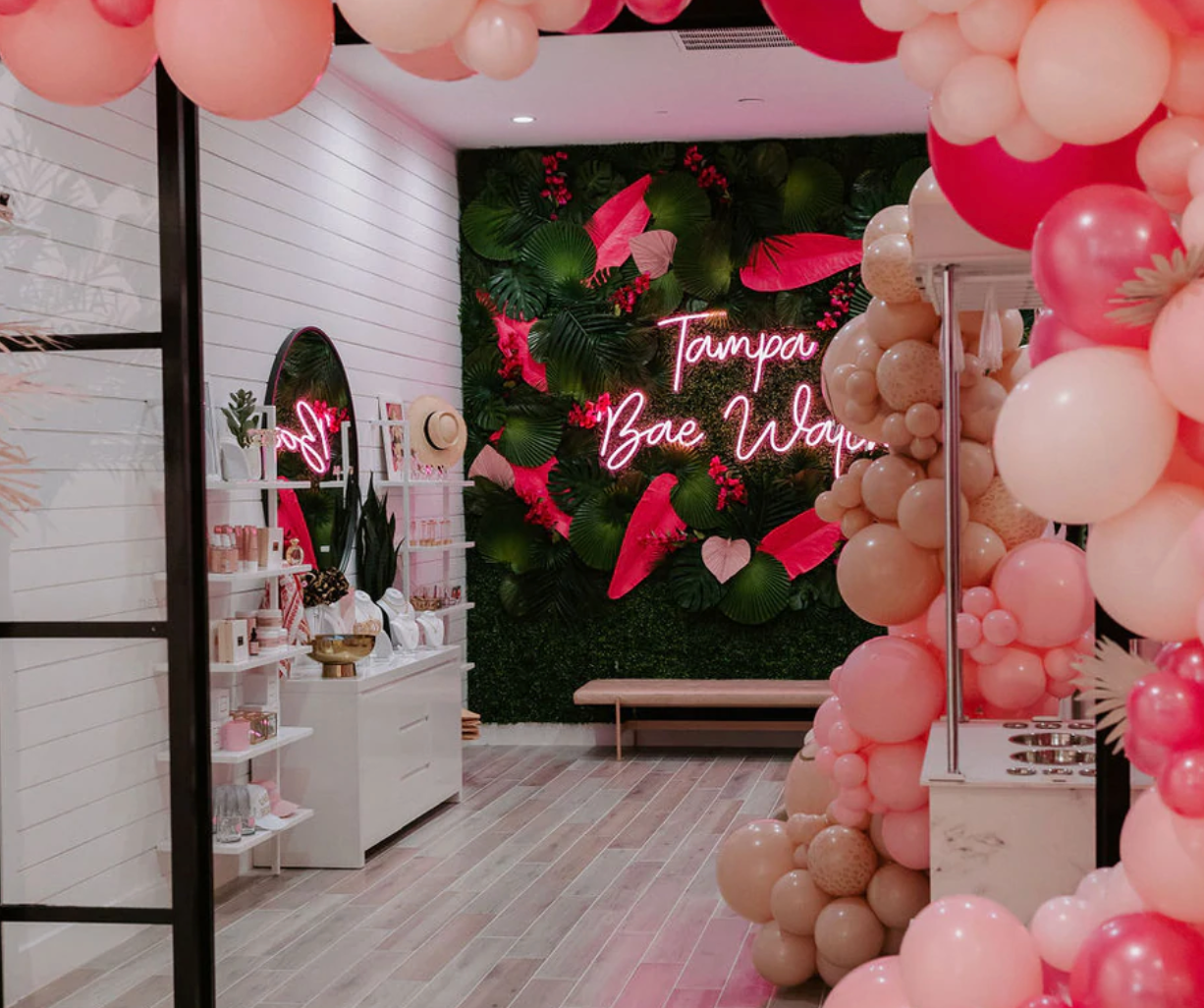 Image of the photo wall located at the Kittenish Tampa retail store.