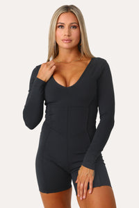 Model wearing the Back It Up long sleeve active onsie.