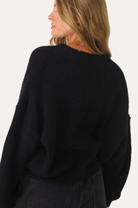 MODEL WEARING THE IN YOUR OWN WAY BLACK BUTTON CARDIGAN