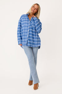 MODEL WEARING SNUGGLE UP BLUE PLAID FLANNEL