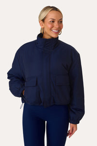 MODEL WEARING JUST CHILLING NAVY PUFFER JACKET