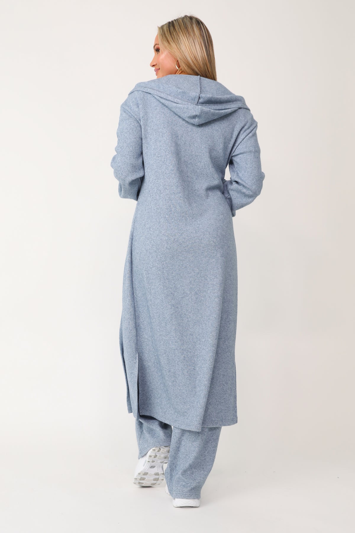 Model wearing the Self Care blue lounge cardigan.