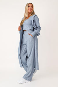 Model wearing the Self Care blue lounge cardigan.