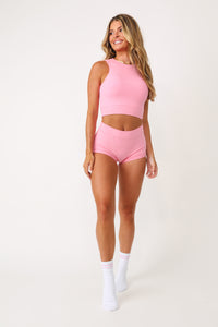 Model wearing the Kittenish basics socks with pink Kittenish logo