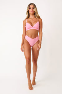 Model wearing the Bubble Gum Pink basics Bralette