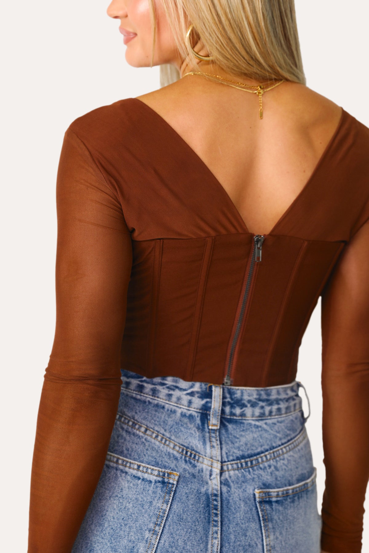 Model wearing the Jaded Corset Top in Spice.