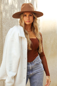 Model wears Broadway Brown Flat Brim Hat 