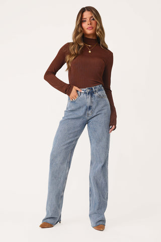 MODEL WEARING COCOA CUTIE LONG SLEEVE TURTLENECK.
