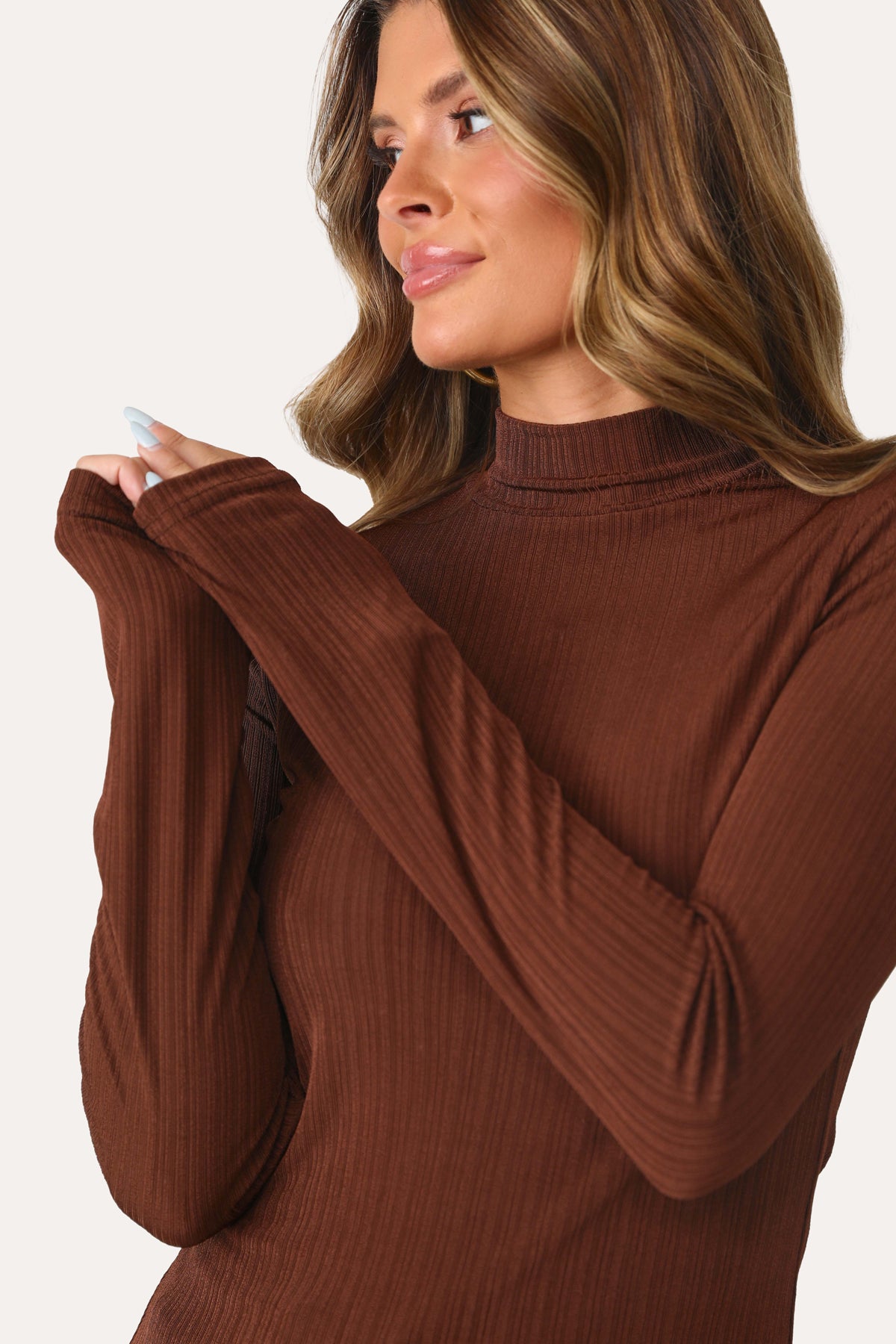 MODEL WEARING COCOA CUTIE LONG SLEEVE TURTLENECK.