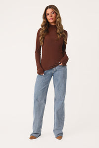 MODEL WEARING COCOA CUTIE LONG SLEEVE TURTLENECK.