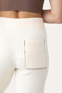 Model wearing Cream Fuzzy Joggers.