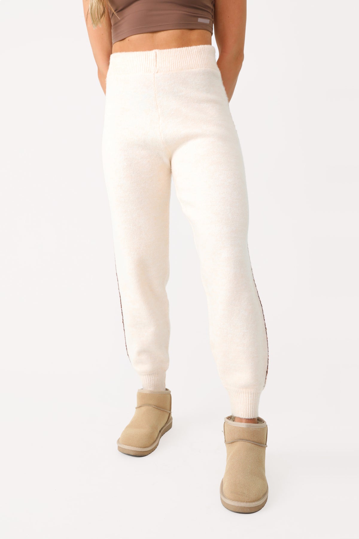 Model wearing Cream Fuzzy Joggers.