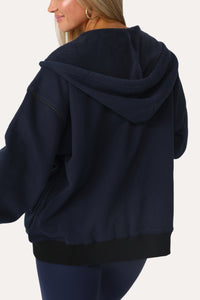 Model wearing the Baller Navy blue + black full zip.