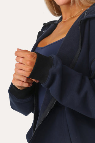 Model wearing the Baller Navy blue + black full zip.