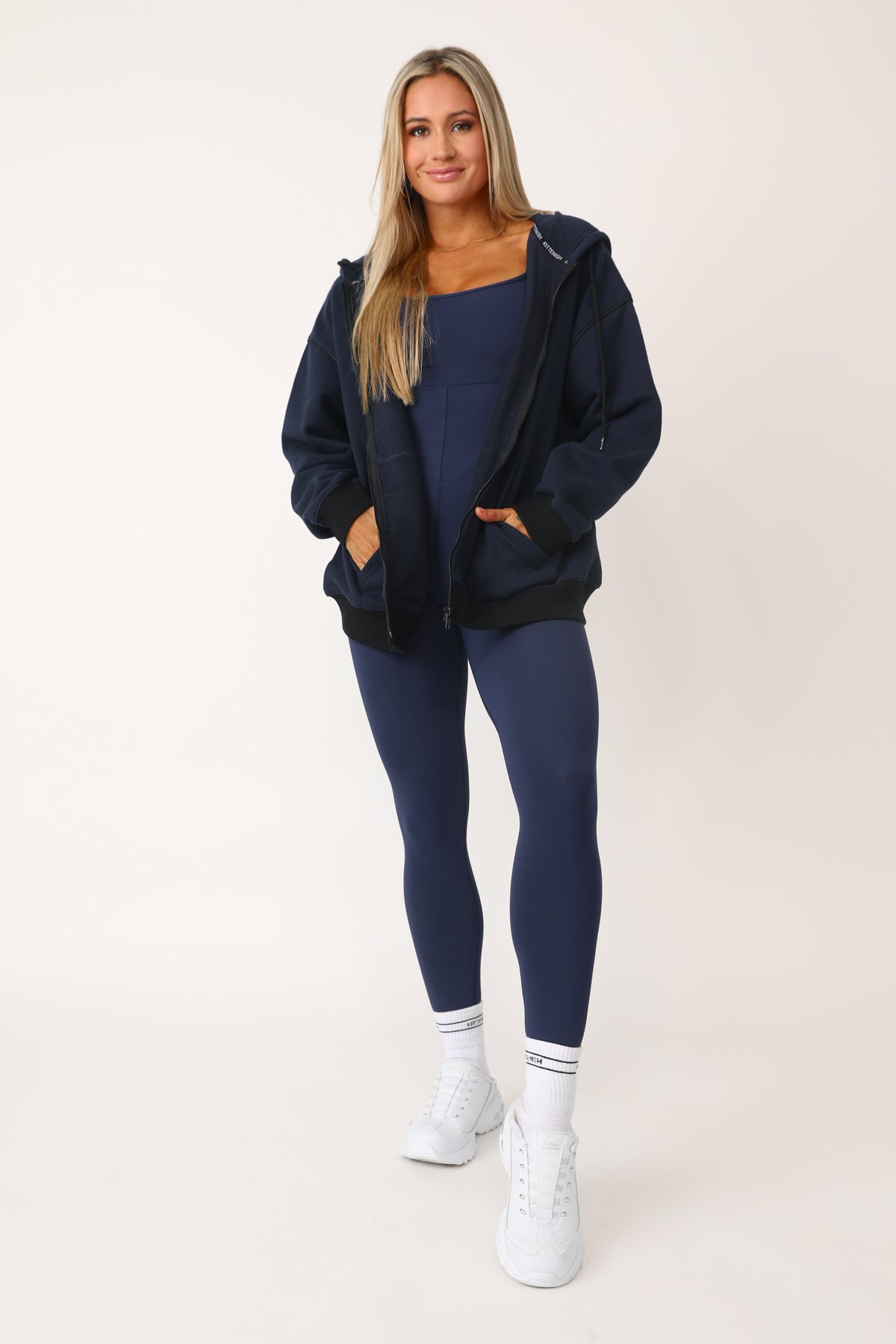 Model wearing the Baller Navy blue + black full zip.